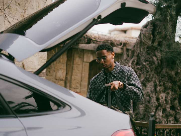 Luggage going into the trunk of a car